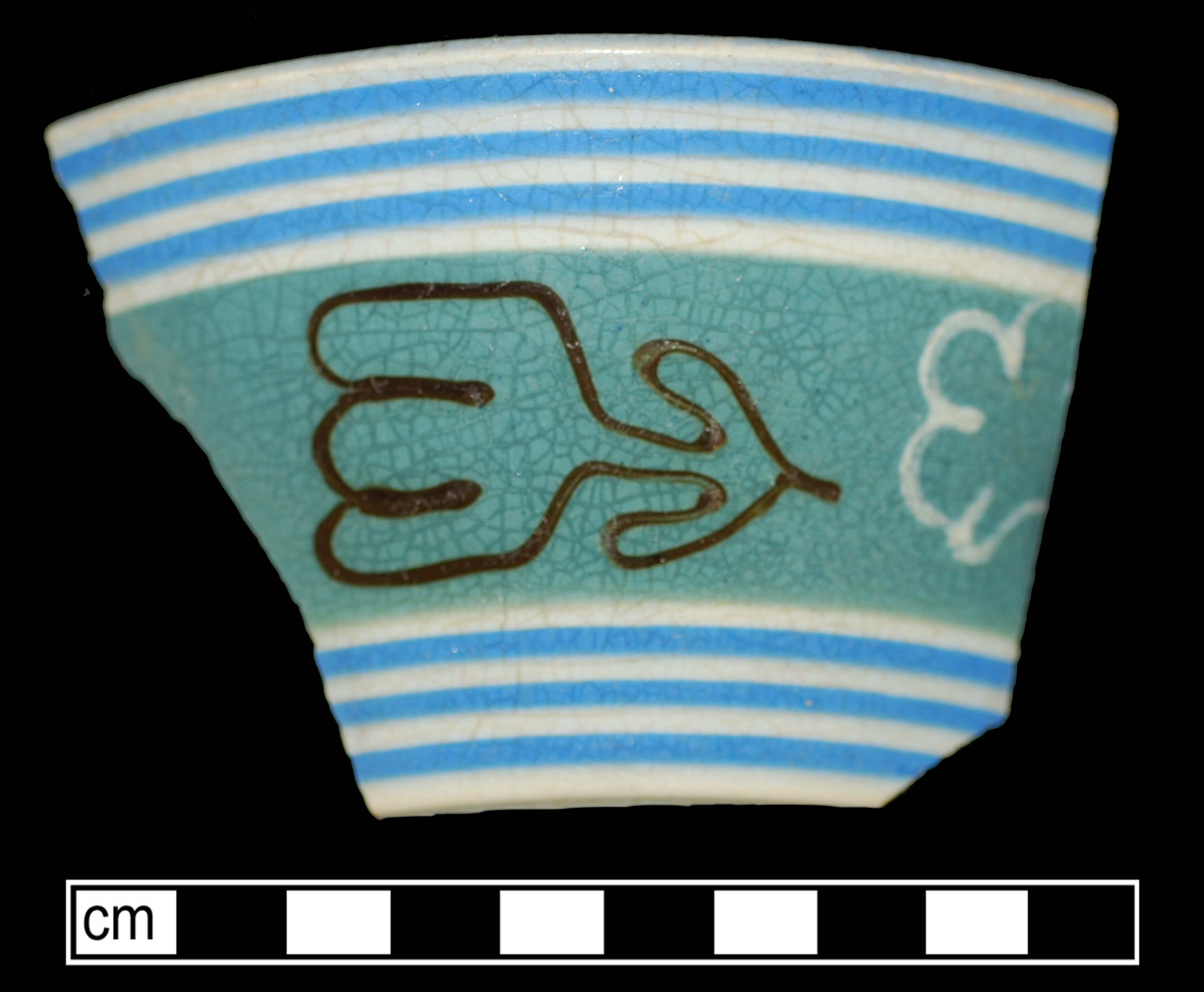Image of dipped earthenware fragment.