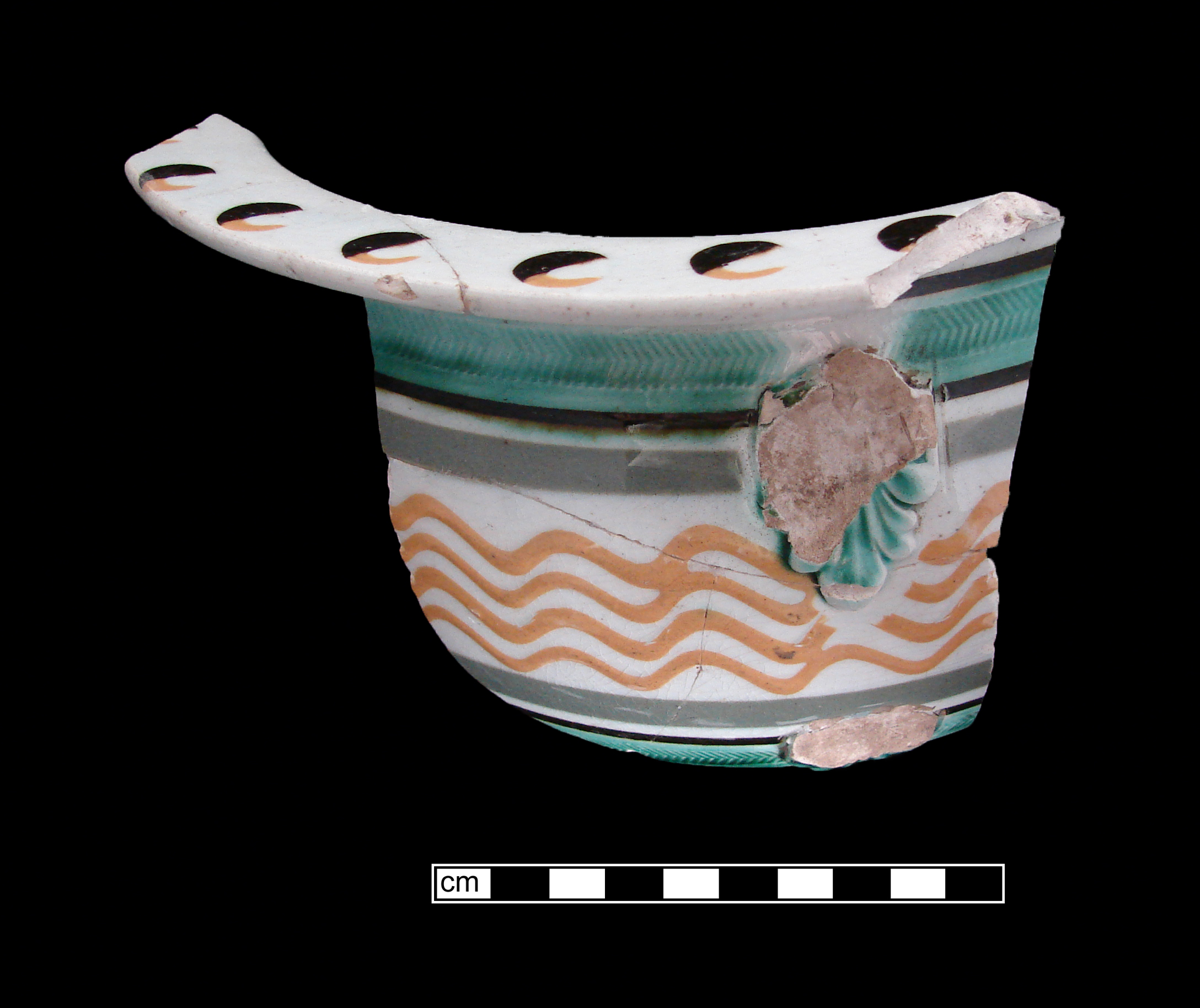 Image of dipped earthenware fragment.