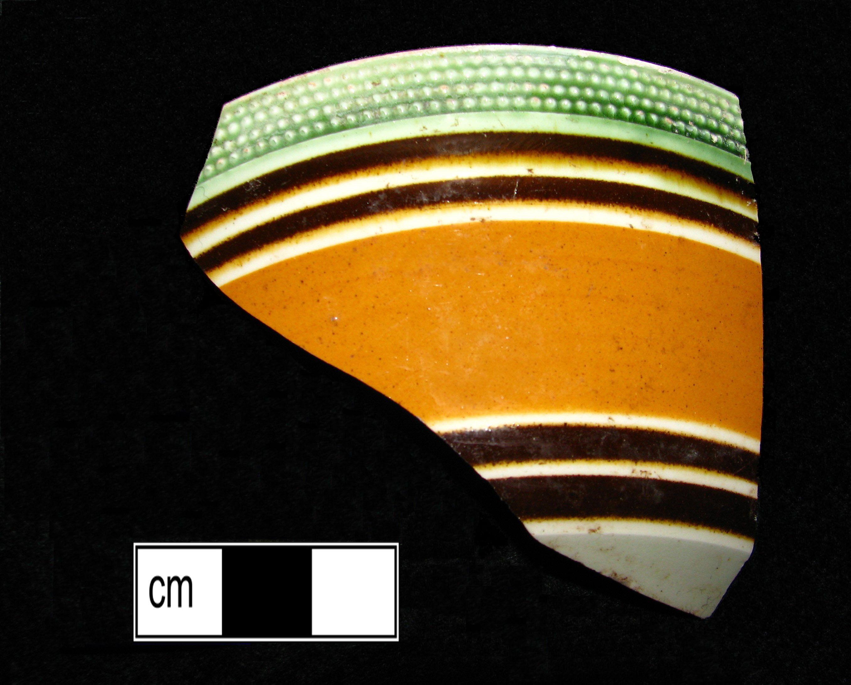 Image of dipped earthenware fragment.
