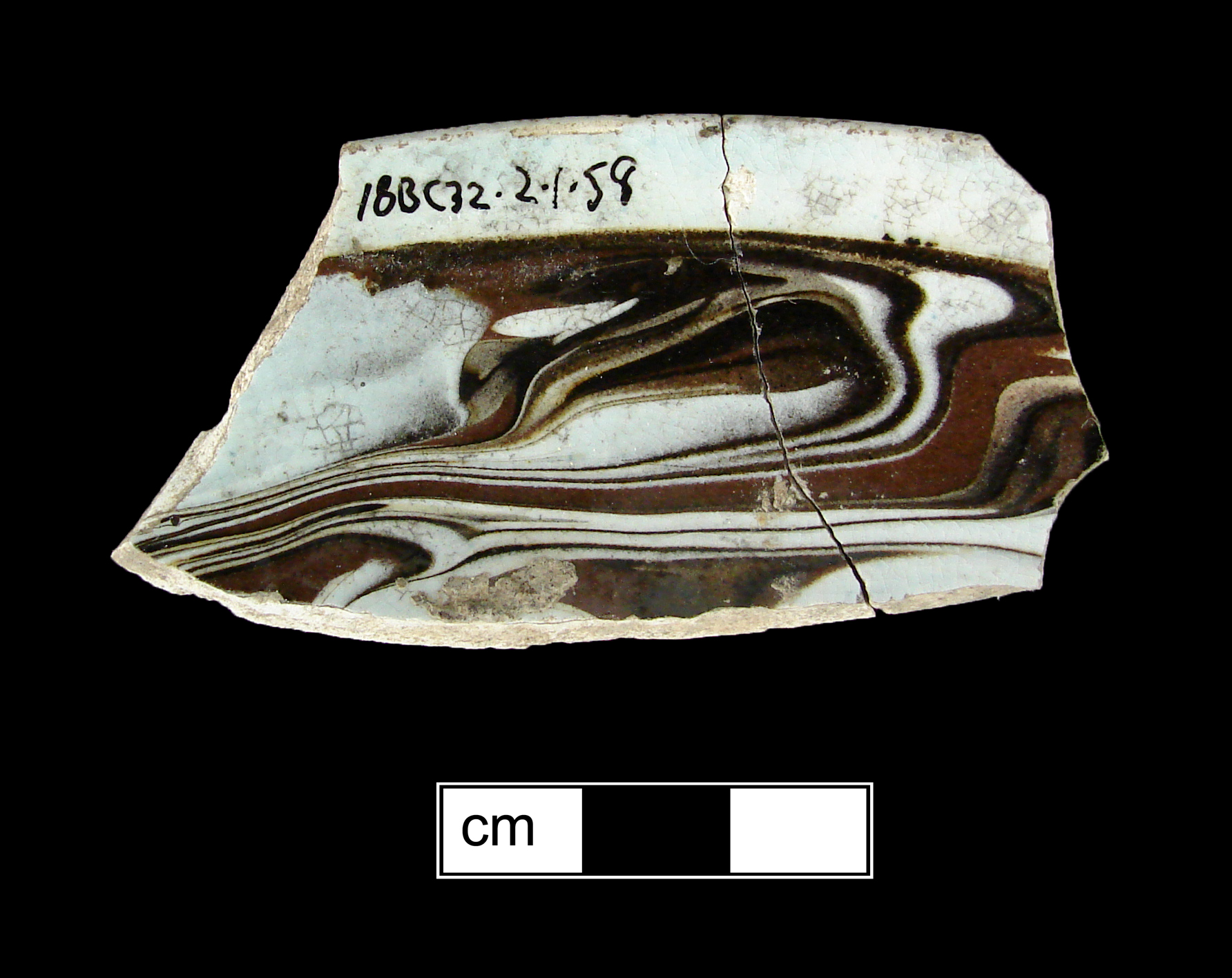 Image of dipped earthenware fragment.
