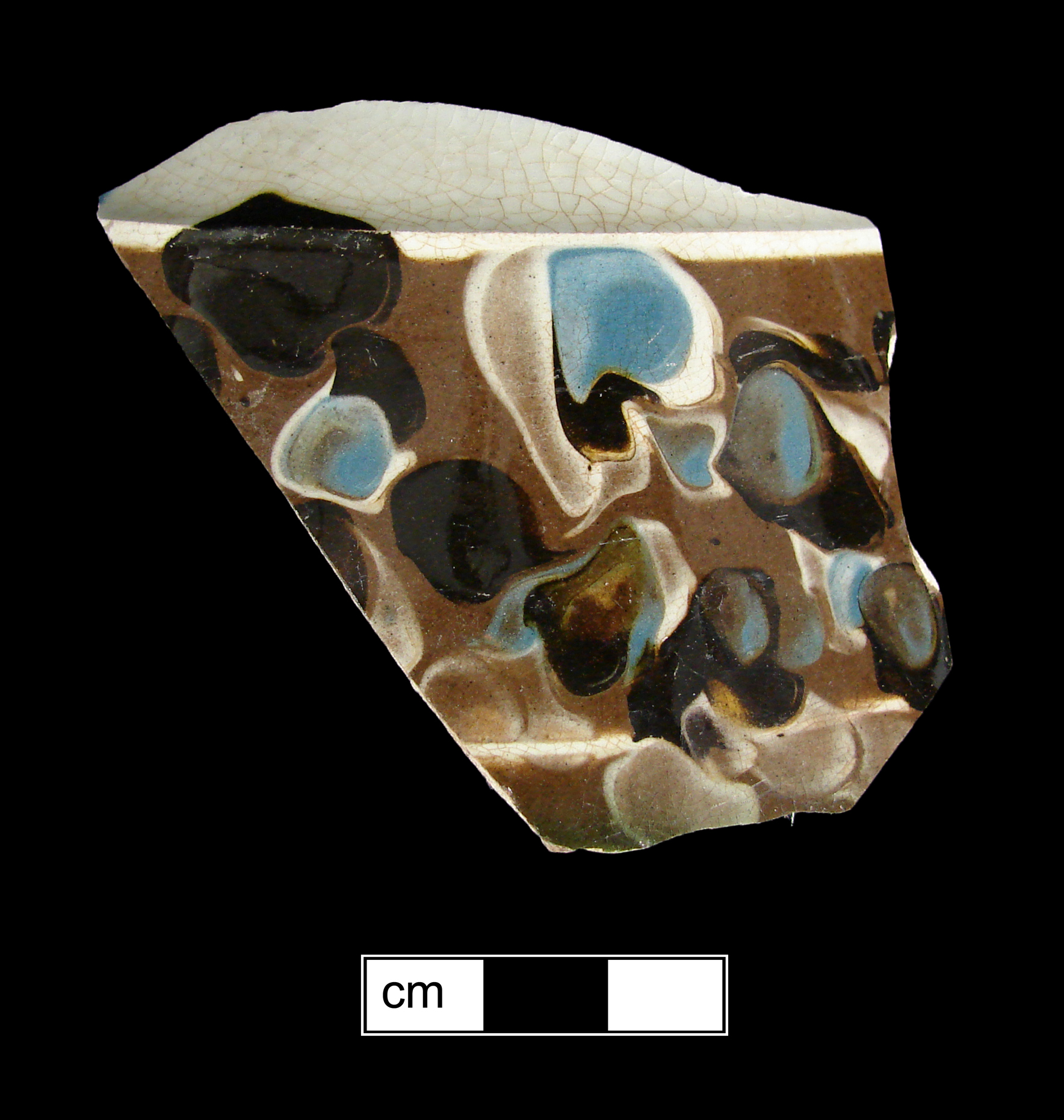 Image of dipped earthenware fragment.