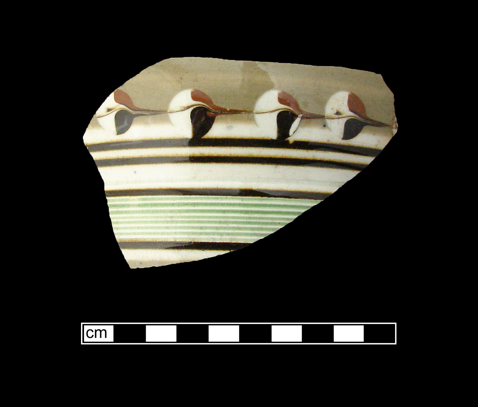Image of dipped earthenware fragment.