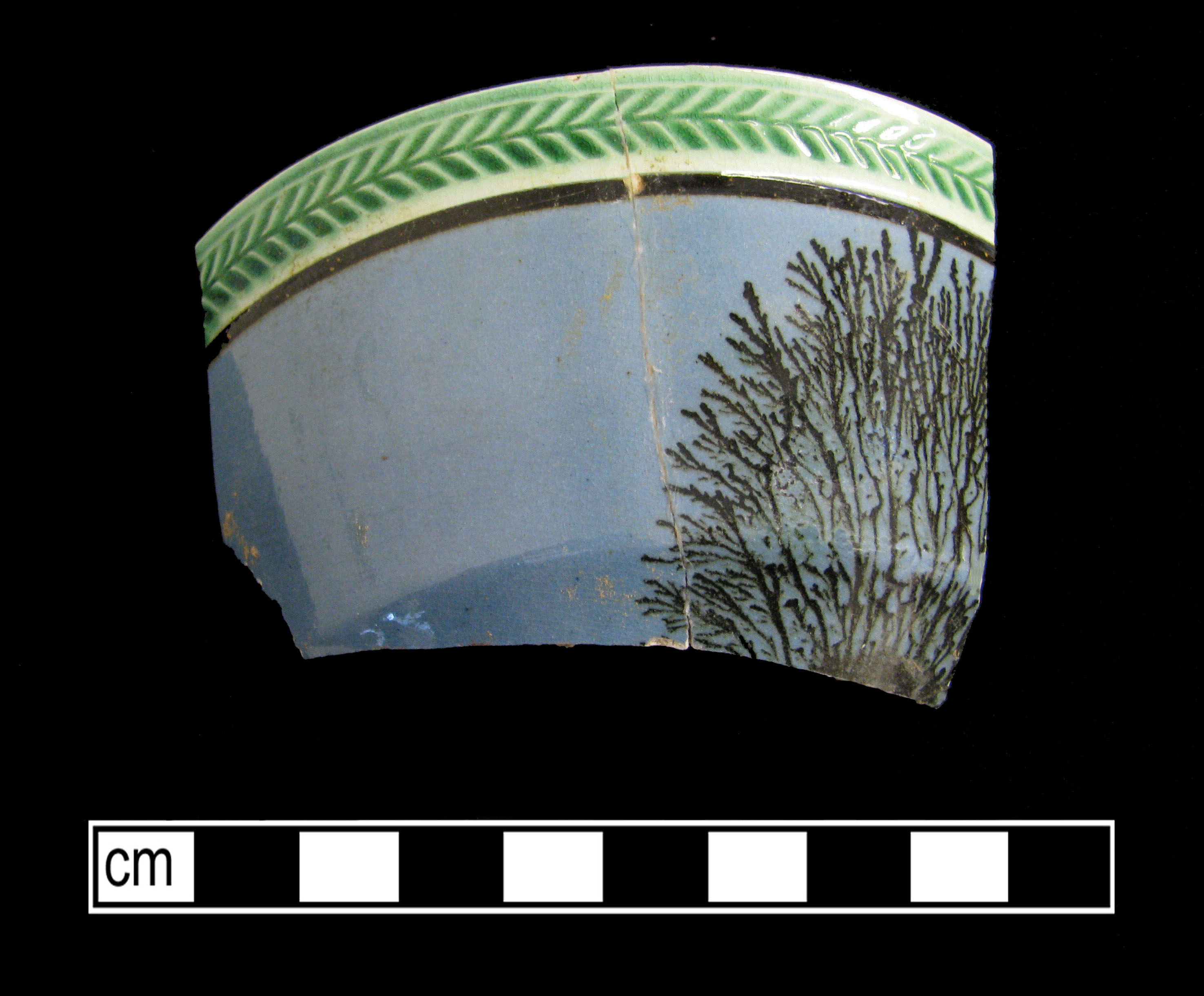 Image of dipped earthenware fragment.