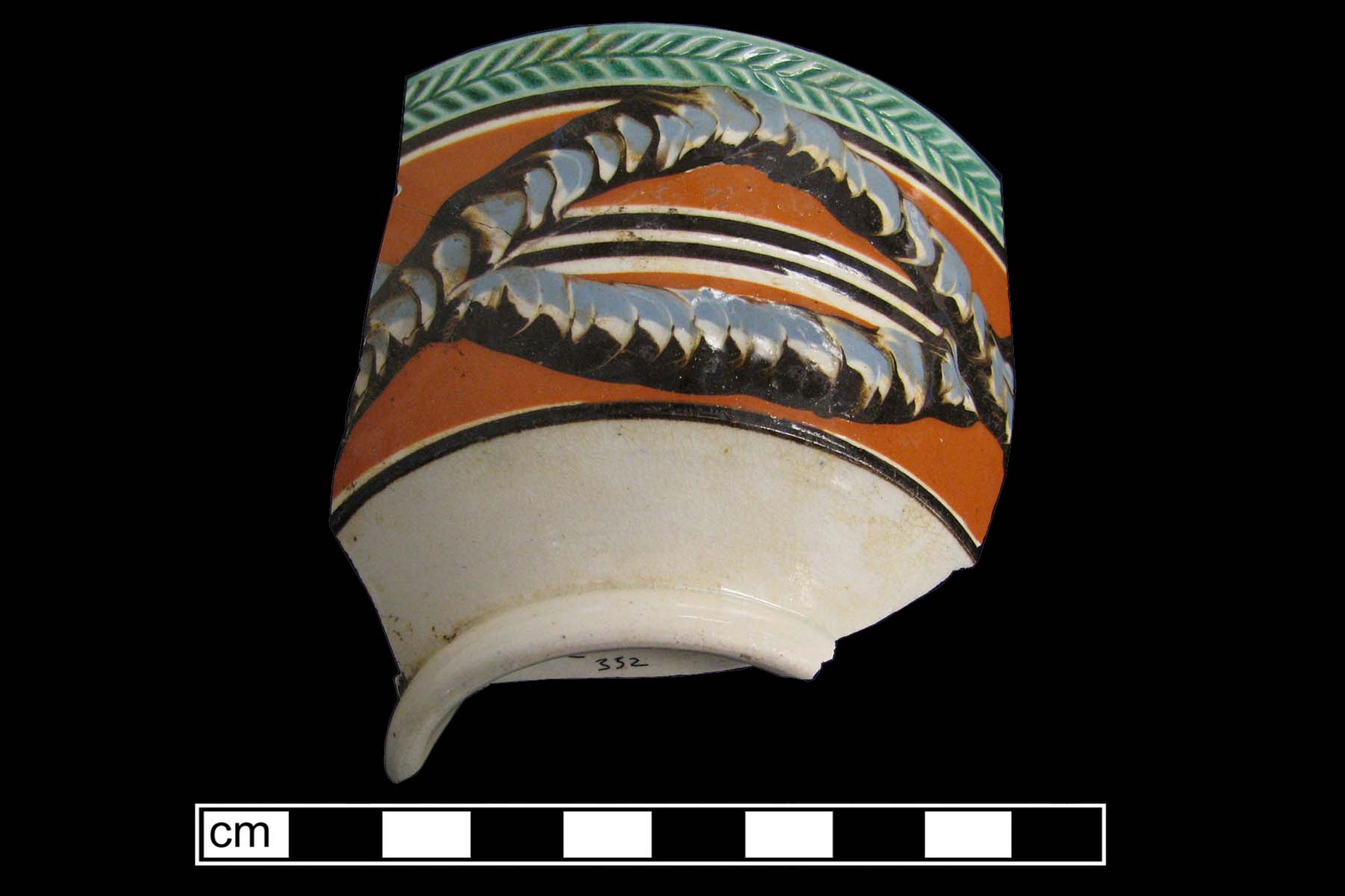 Image of dipped earthenware fragment.