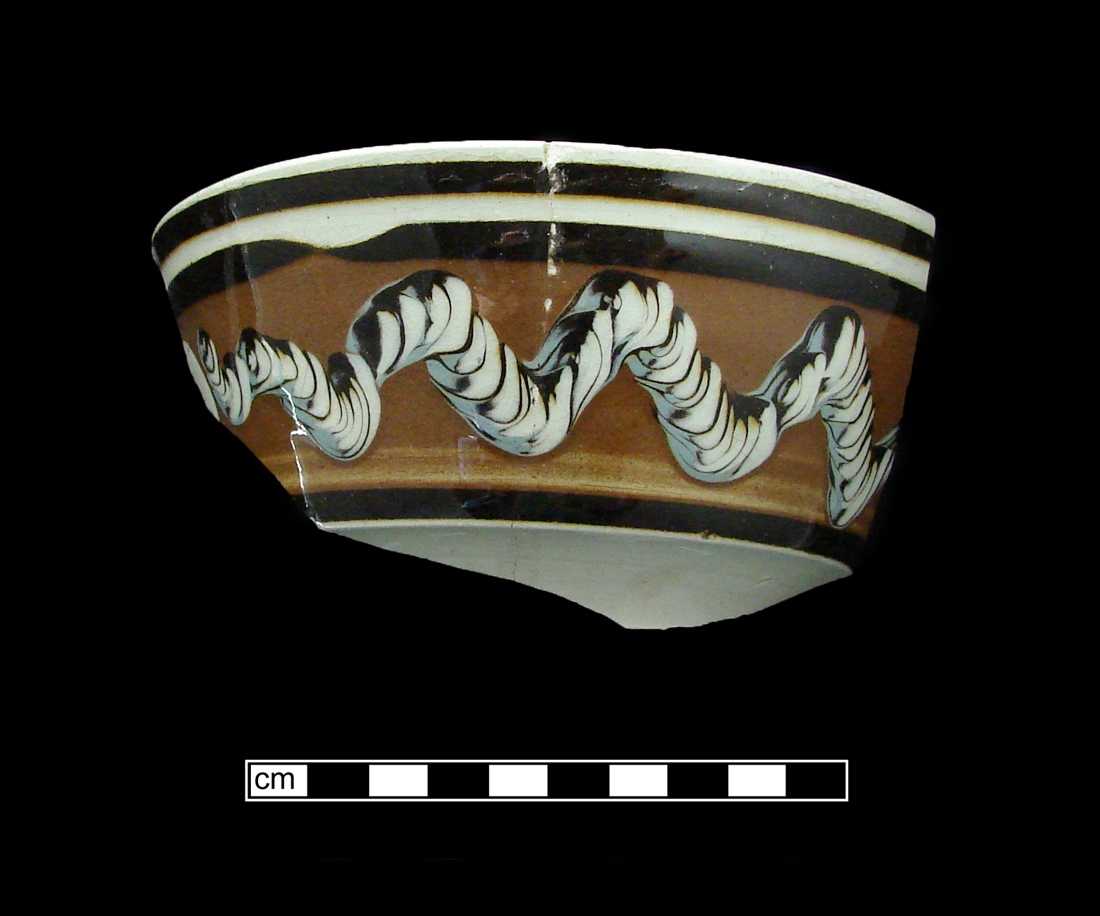 Image of dipped earthenware fragment.
