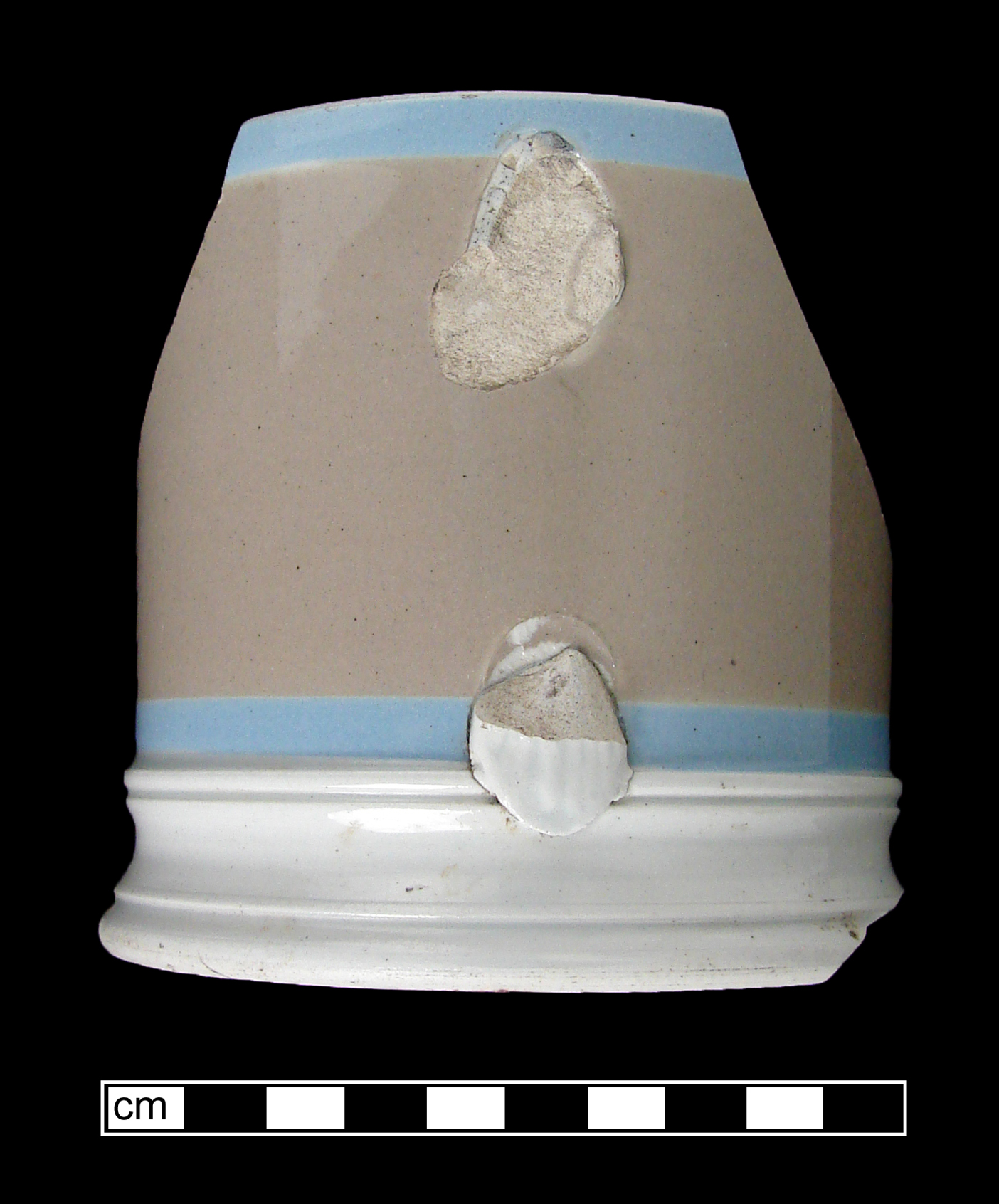 Image of dipped earthenware fragment.