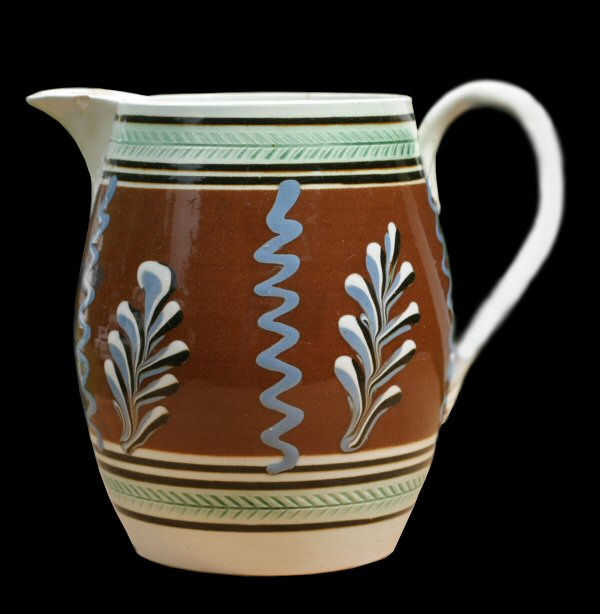 Image of dipped earthenware fragment.
