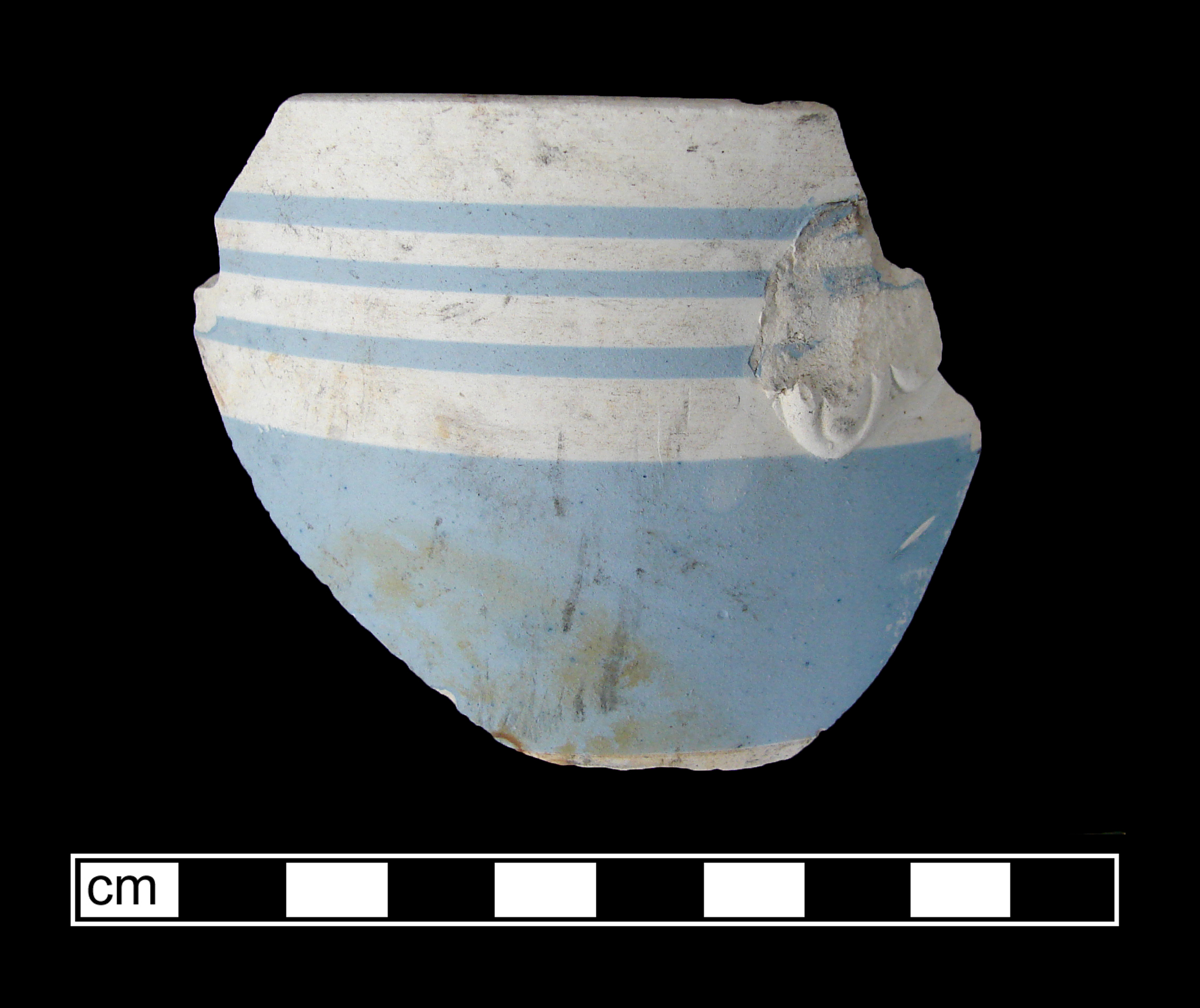Image of dipped earthenware fragment.