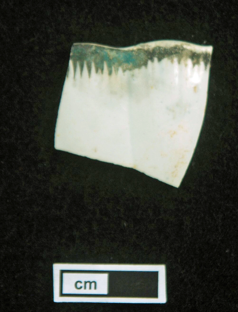 Image of edged earthenware fragment.