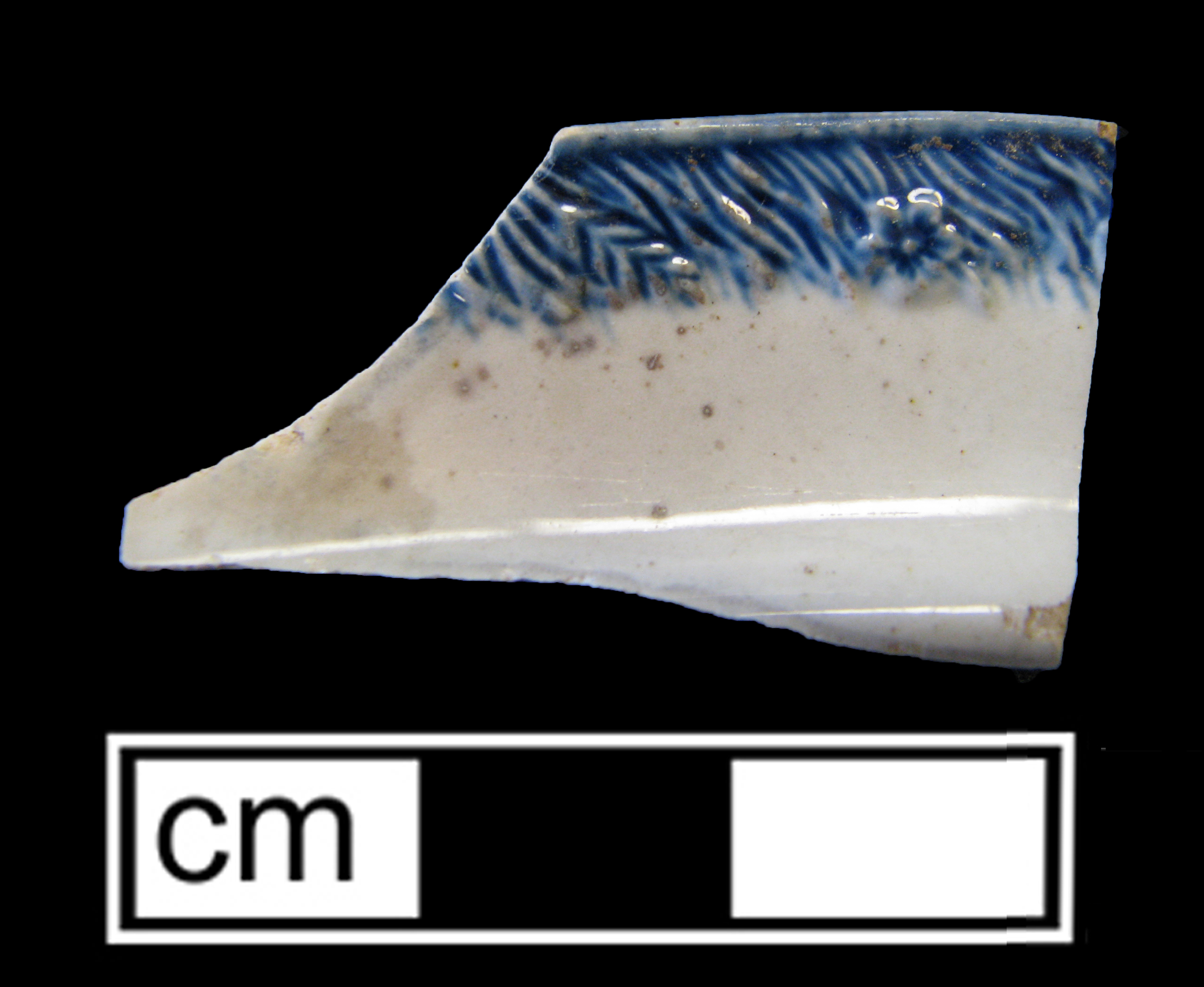 Image of edged earthenware fragment.