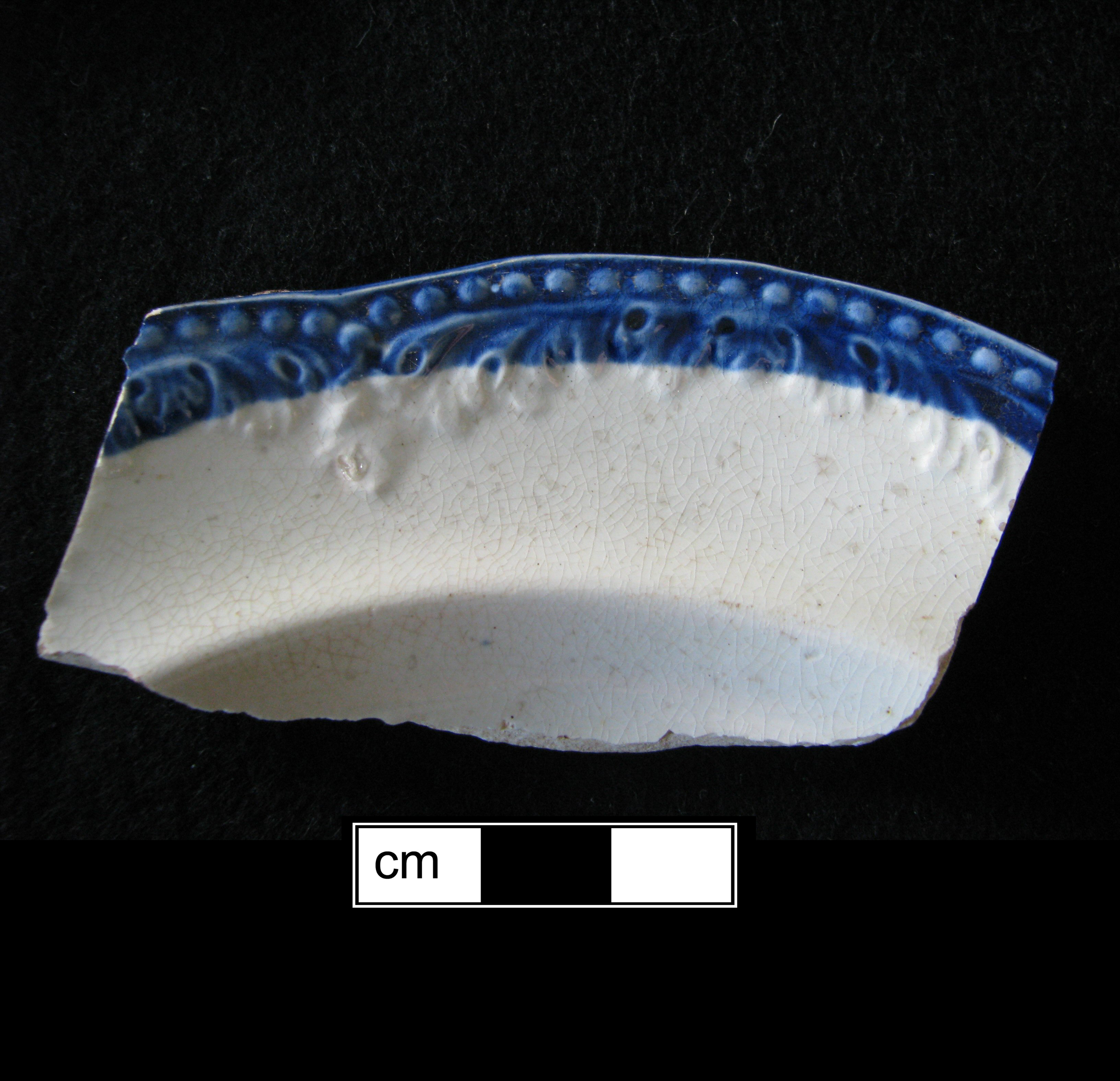 Image of edged earthenware fragment.