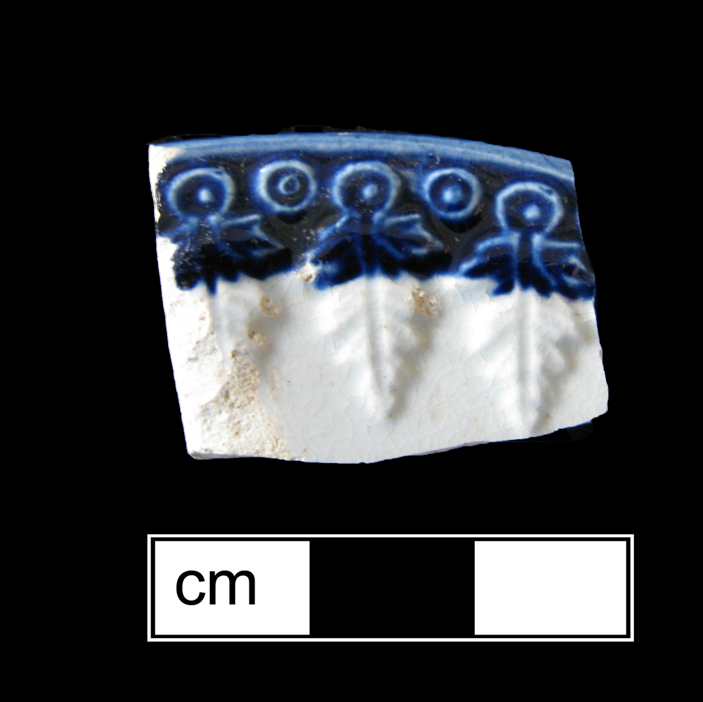 Image of edged earthenware fragment.