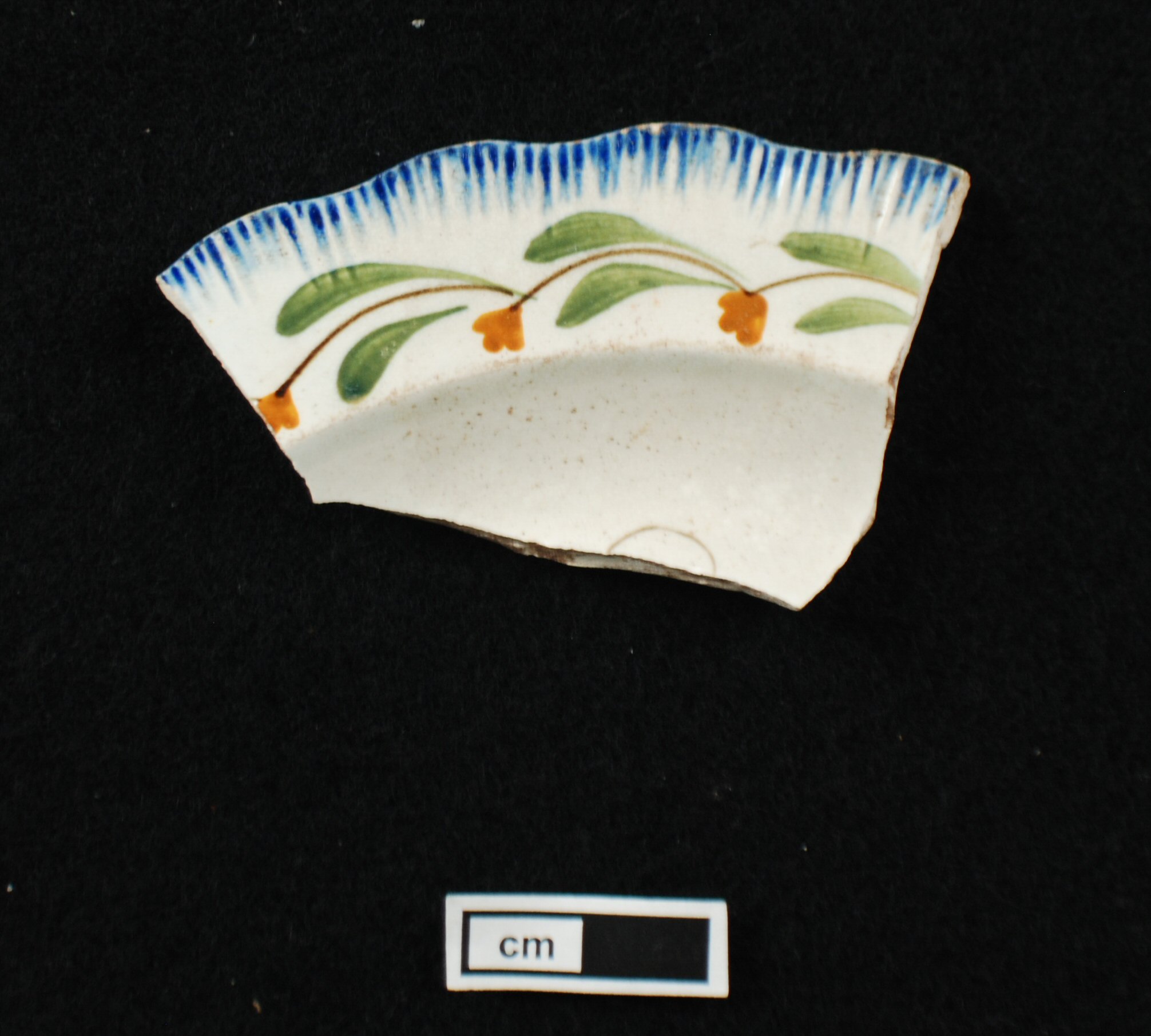 Image of edged earthenware fragment.