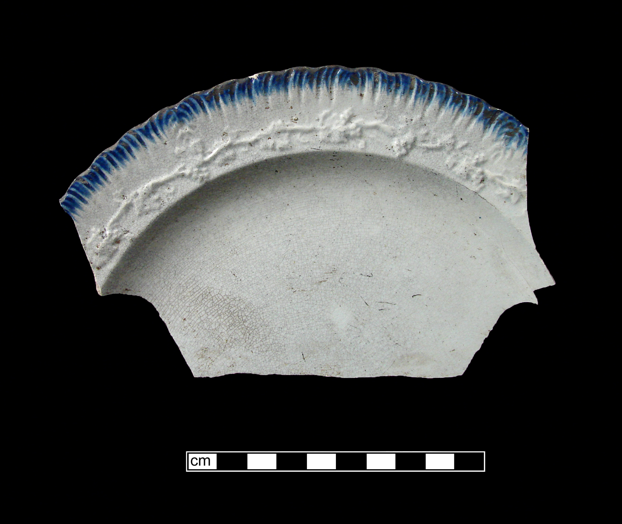 Image of edged earthenware fragment.