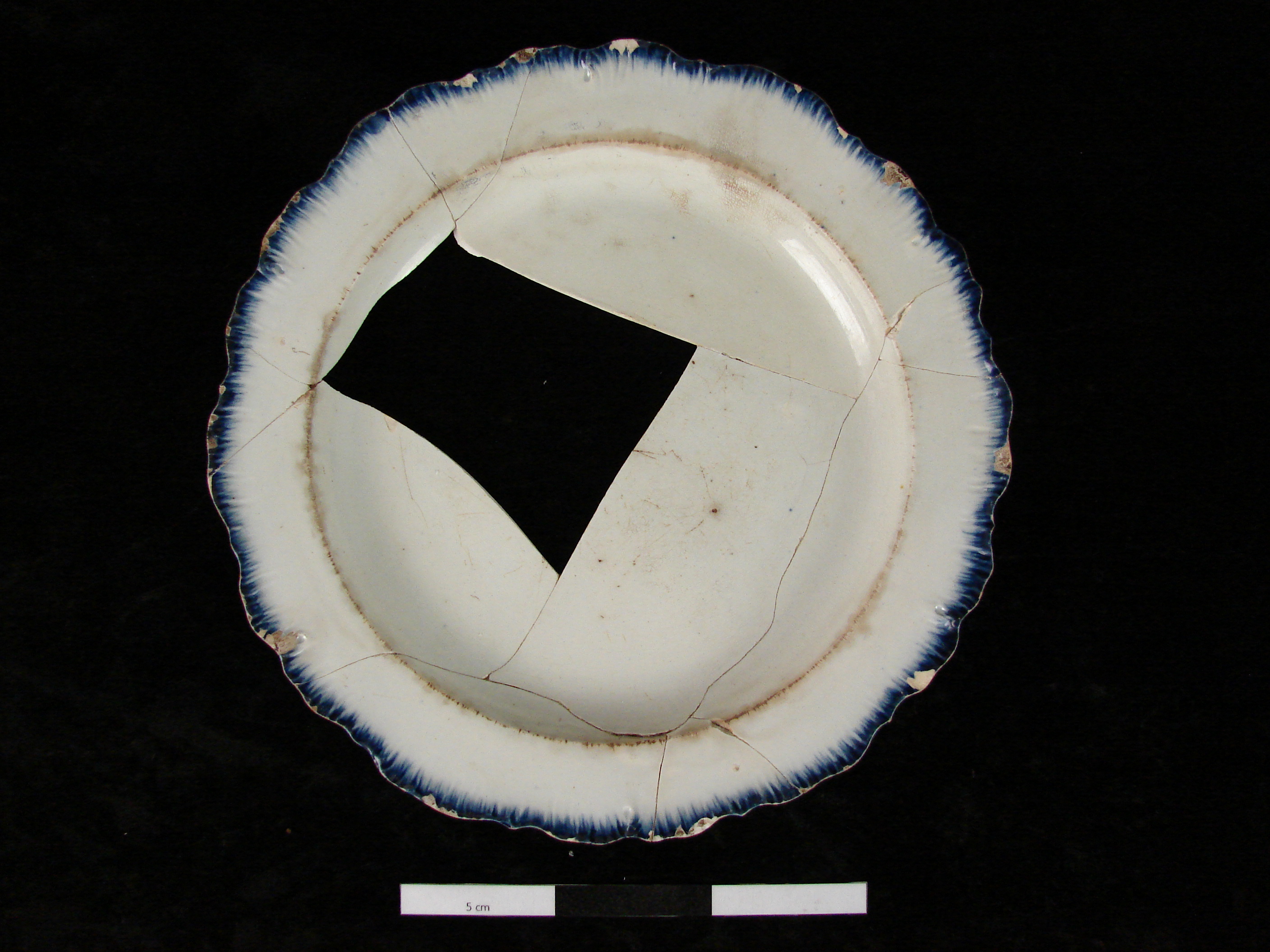 Image of edged earthenware fragment.