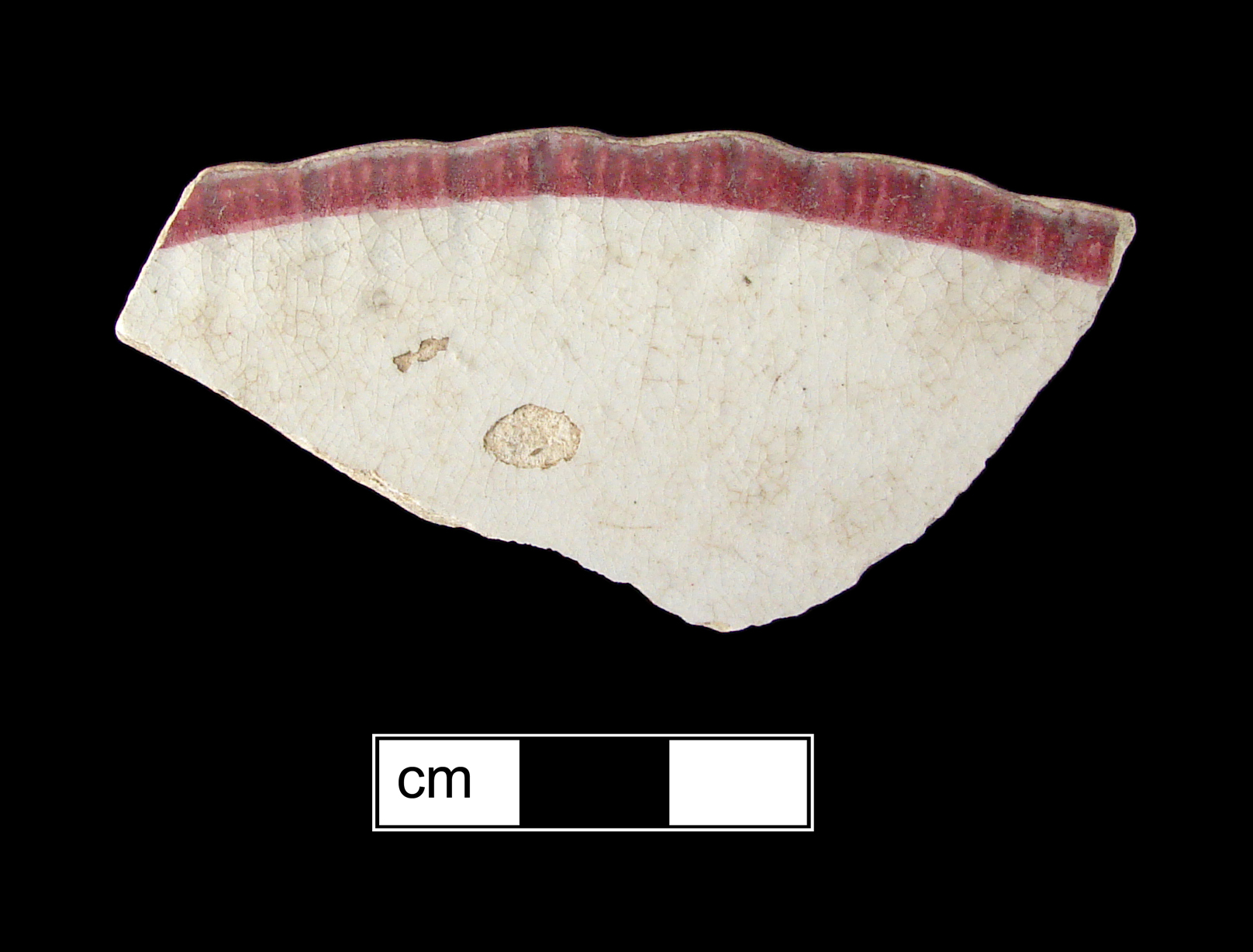 Image of edged earthenware fragment.