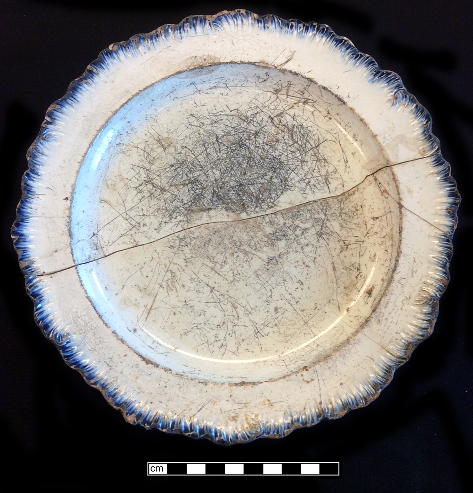 Image of edged earthenware fragment.