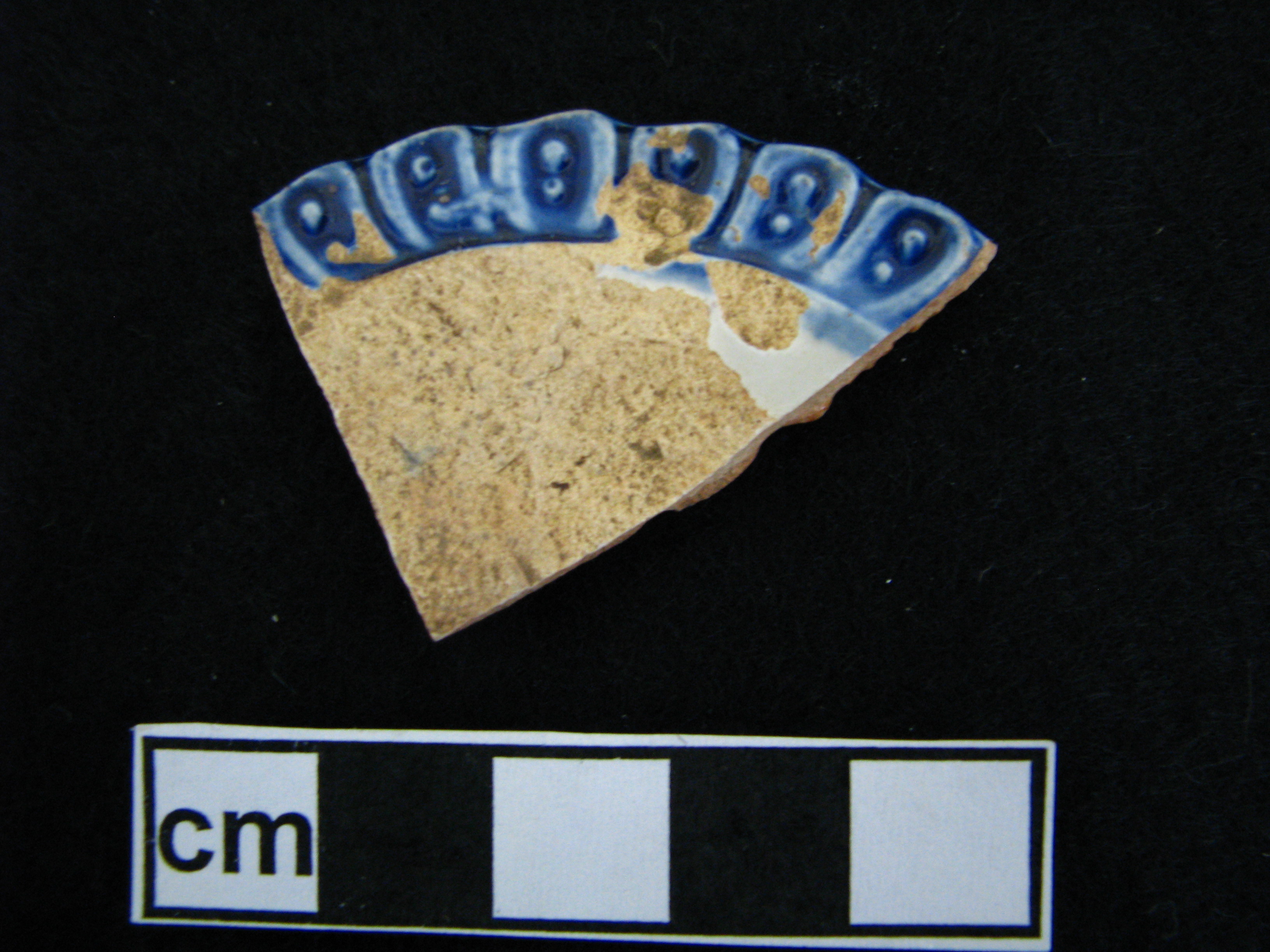 Image of edged earthenware fragment.