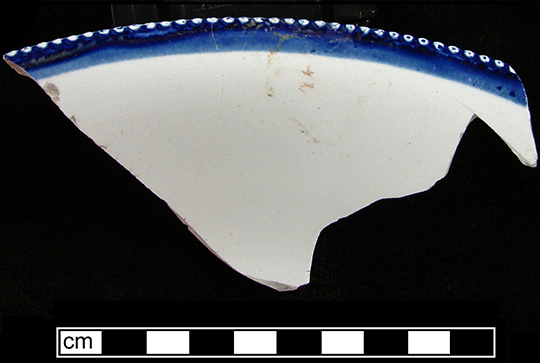 Image of edged earthenware fragment.
