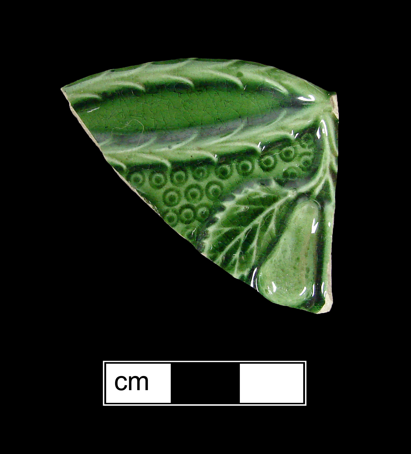 Image of green glazed earthenware fragment.