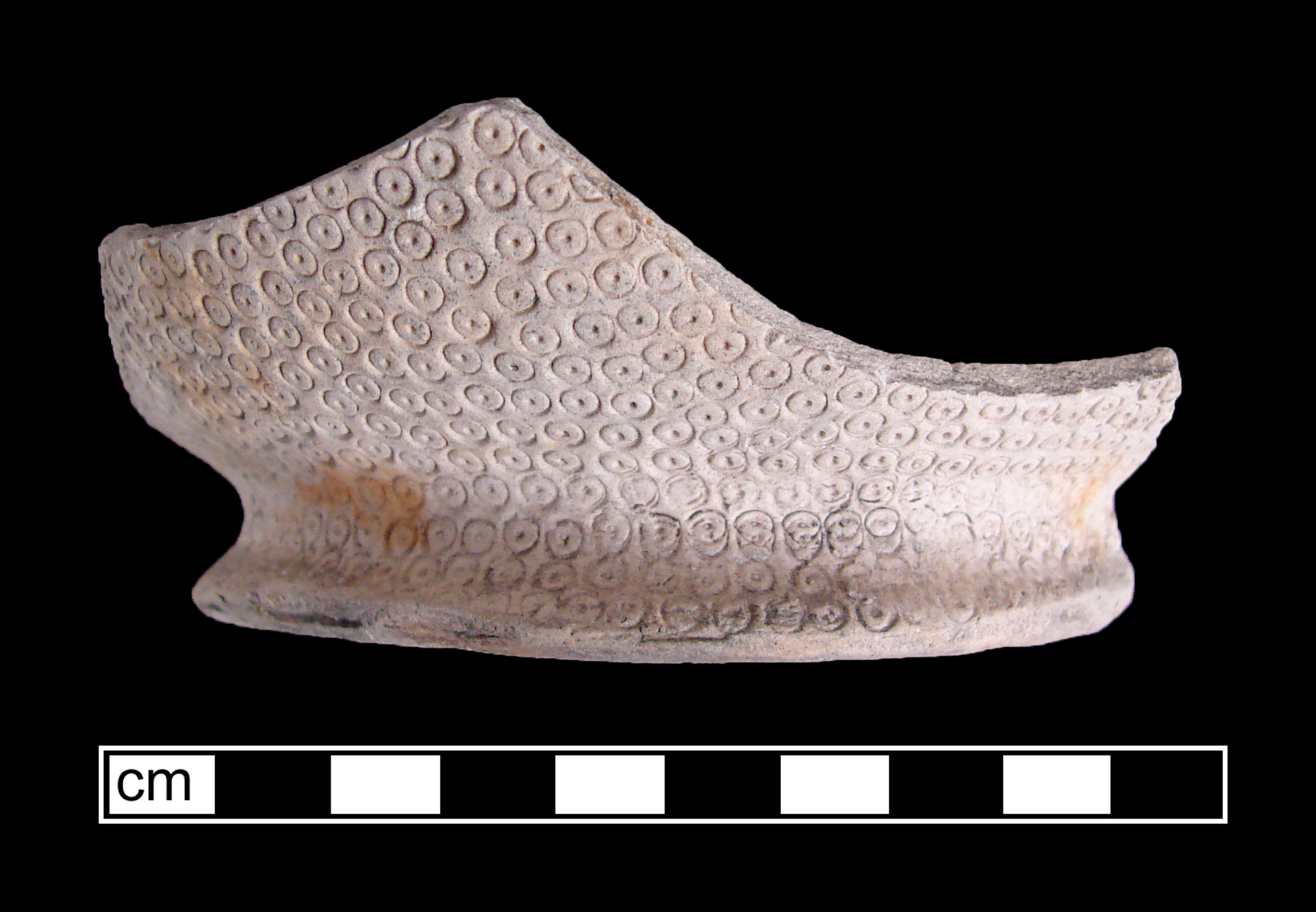 Image of green glazed earthenware fragment.