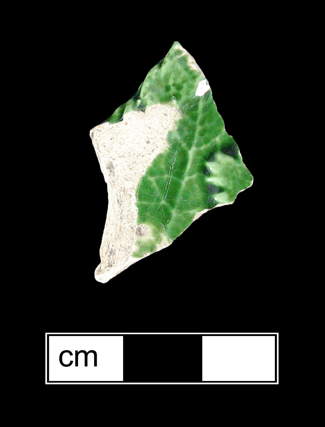 Image of green glazed earthenware fragment.