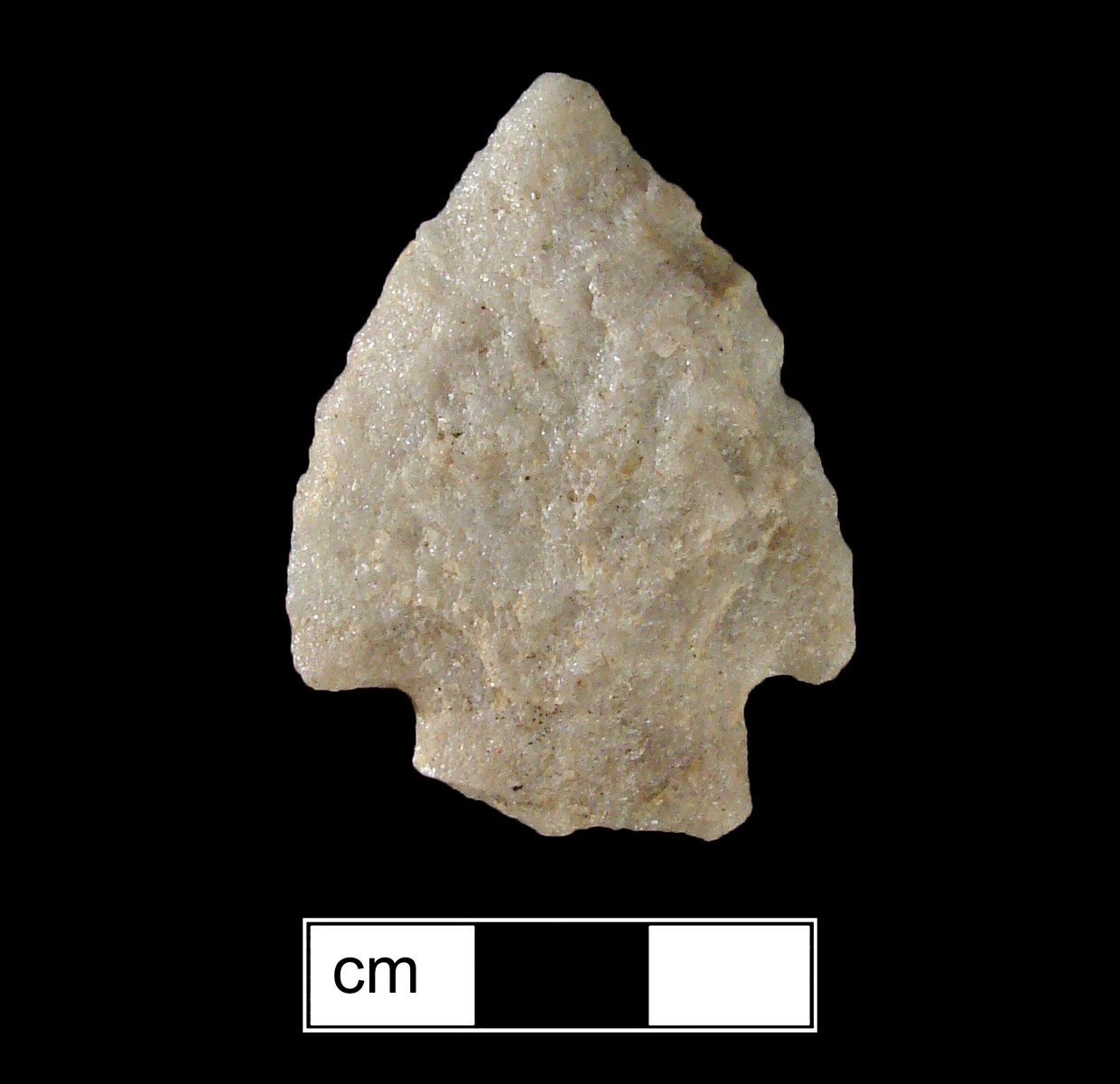 Image of stone projectile point made of Quartzite, Corner-Notched shape, with a Straight stem, Excurvate blade, and Straight base shape. Brewerton Corner Notched type.