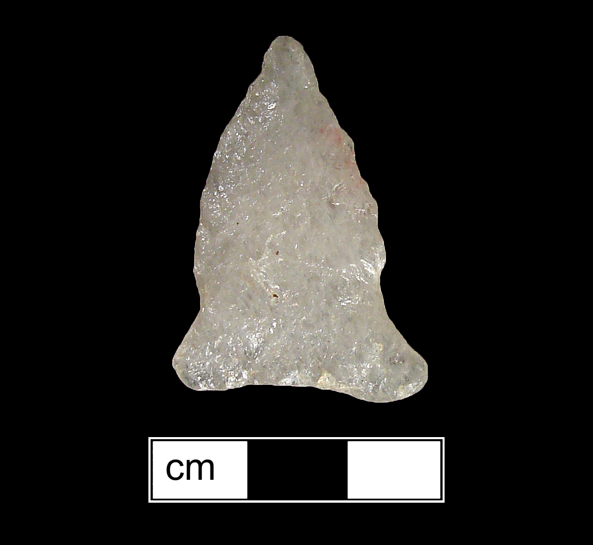 Image of stone projectile point made of Quartz, Side-Notched shape, with a Expanding stem, Excurvate blade, and Concave base shape. Brewerton Eared Notched type.