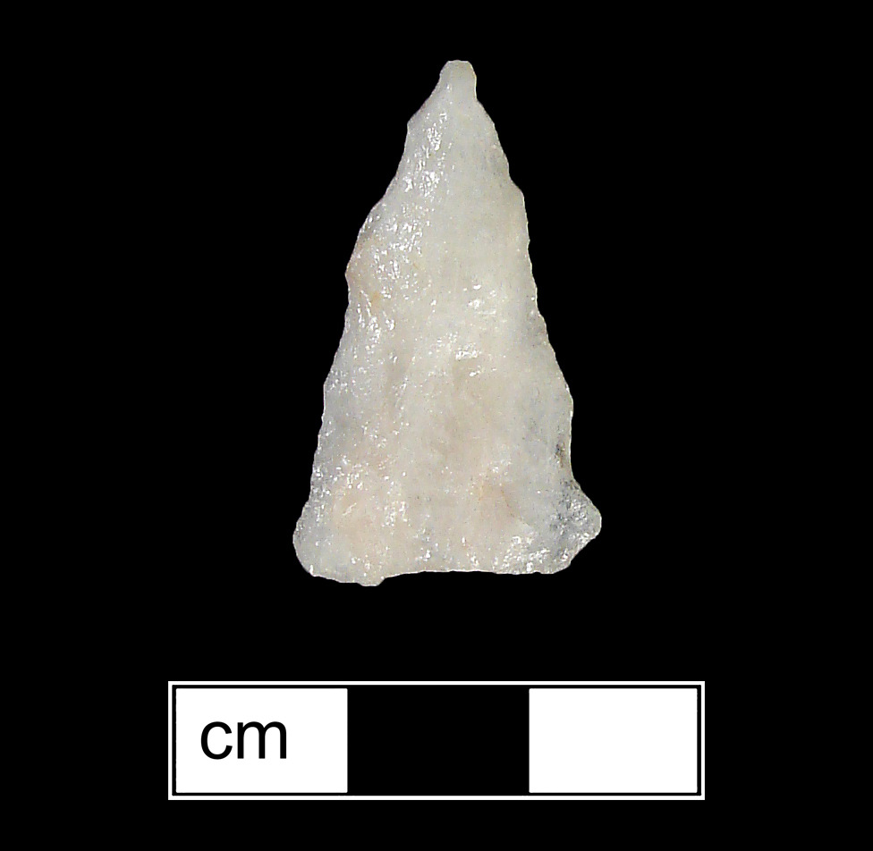 Image of stone projectile point made of Quartz, Triangular shape, with a N/A stem, Straight blade, and Straight base shape. Brewerton Eared Triangle type.