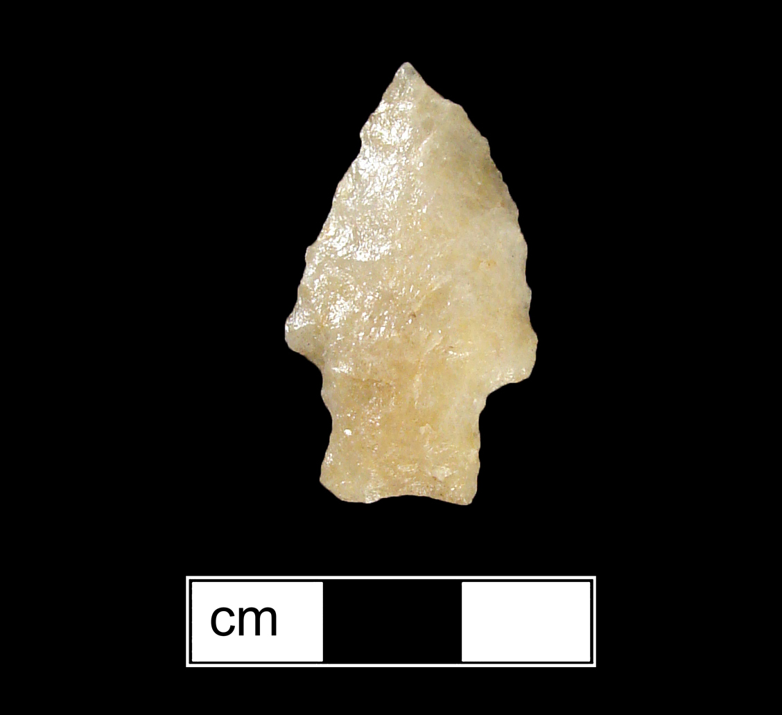 Image of stone projectile point made of Quartz, Stemmed shape, with a Straight stem, Excurvate blade, and Concave base shape. Calvert type.