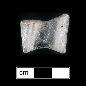 Image of stone projectile point made of Quartz, Lanceolate shape, with a N/A stem, Unknown blade, and Concave base shape. Clovis type.