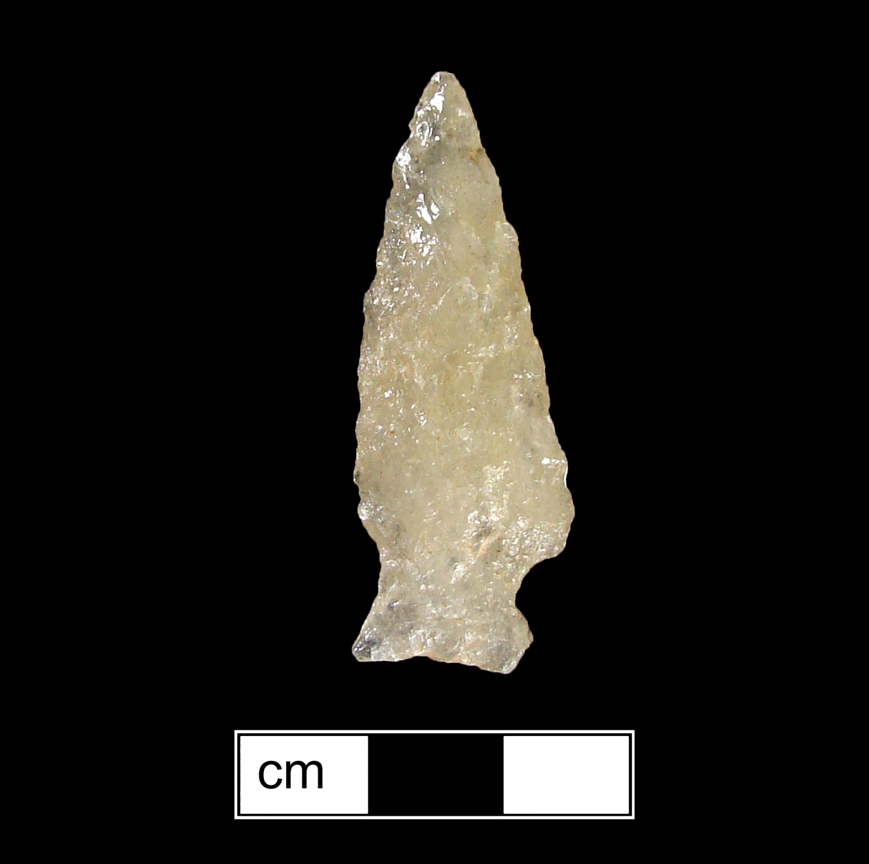 Image of stone projectile point made of Quartz, Stemmed shape, with a Expanding stem, Excurvate blade, and Concave base shape. Fishtail type.