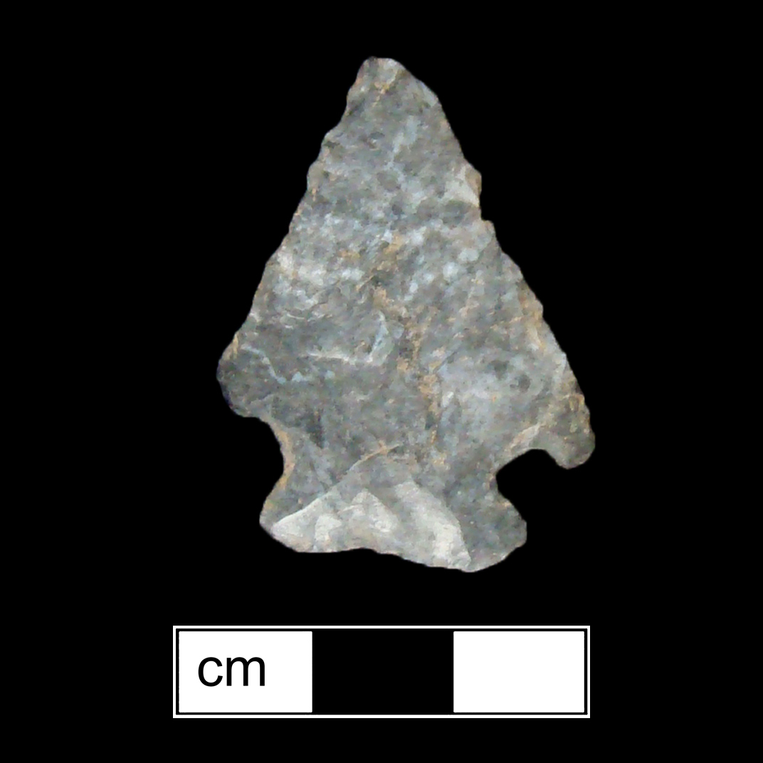 Image of stone projectile point made of Chert, Corner-Notched shape, with a Expanding stem, Straight blade, and Straight base shape. Kirk Corner Notched type.