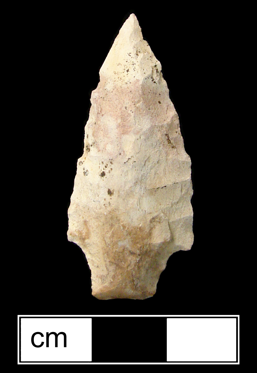 Image of stone projectile point made of Jasper, Stemmed shape, with a Contracting stem, Excurvate blade, and Straight base shape. Lamoka type.