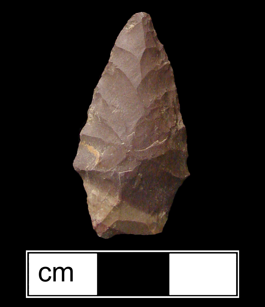Image of stone projectile point made of Jasper, Stemmed shape, with a Contracting stem, Straight blade, and Concave base shape. Lamoka type.