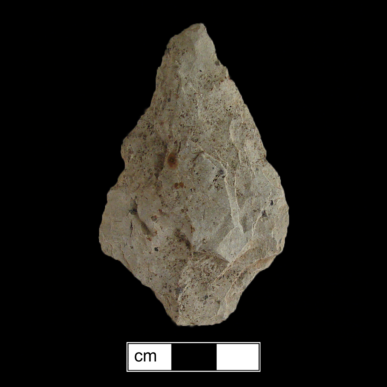 Image of stone projectile point made of Rhyolite, Contracting Stem shape, with a Contracting stem, Straight blade, and Straight base shape. Lehigh/Koens-Crispin type.