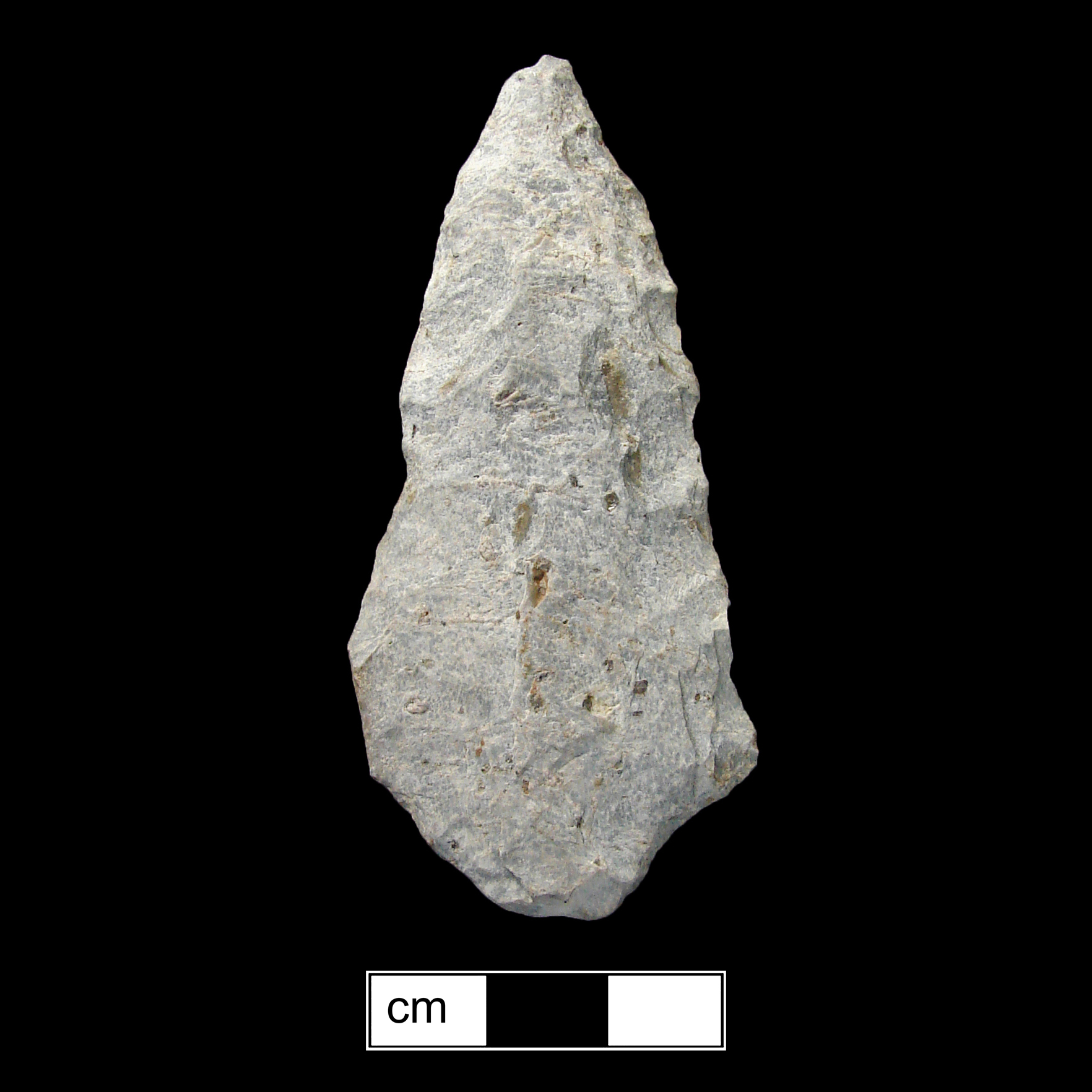 Image of stone projectile point made of Rhyolite, Contracting Stem shape, with a contracting stem, Excurvate blade, and Straight base shape. Lehigh/Koens-Crispin type.