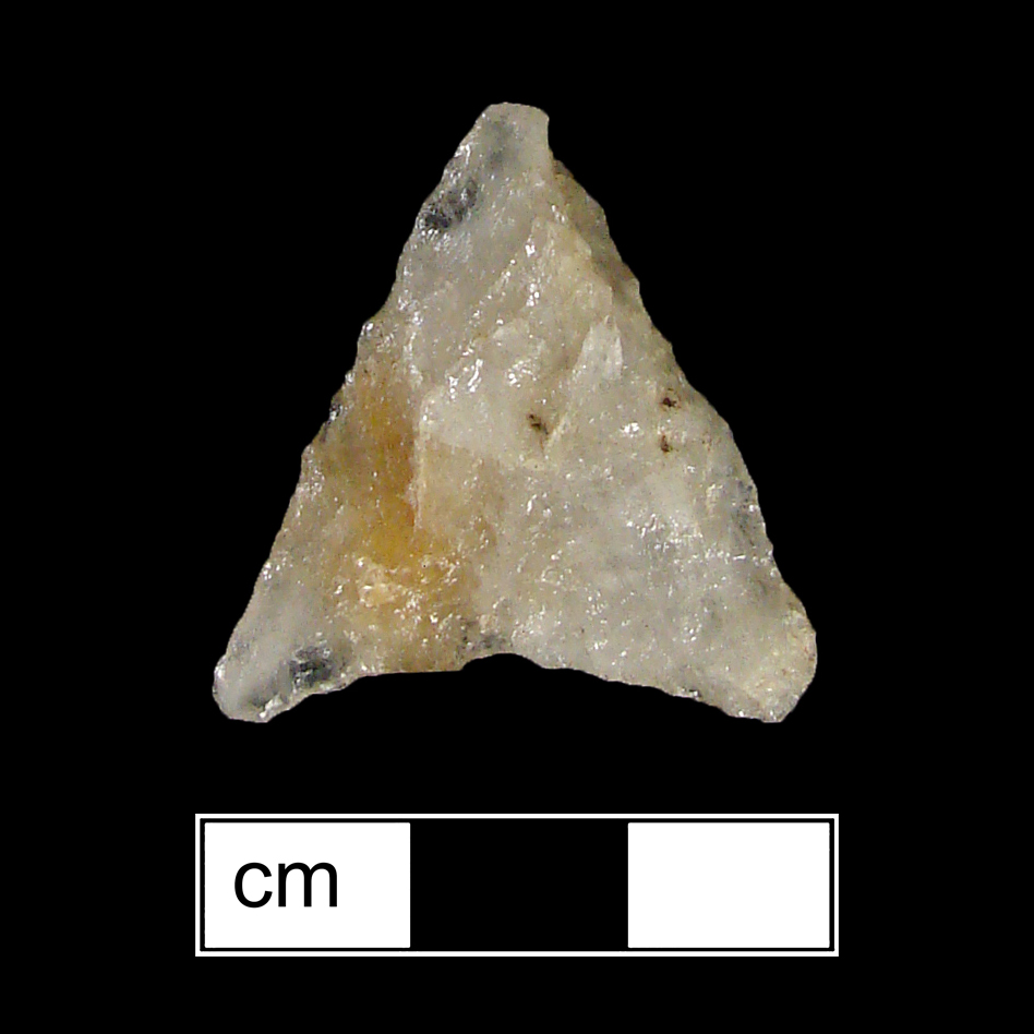 Image of stone projectile point made of Quartz, Triangular shape, with a N/A stem, Straight blade, and Concave base shape. Levanna type.