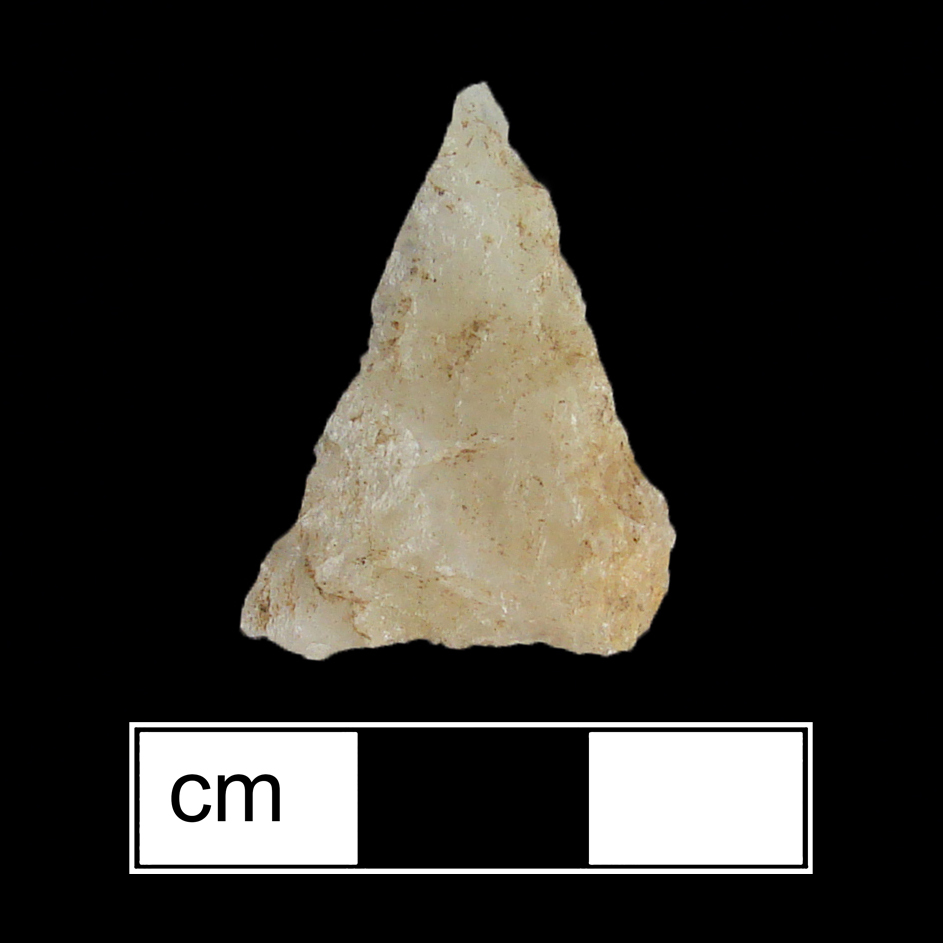 Image of stone projectile point made of Quartz, Triangular shape, with a N/A stem, Straight blade, and Straight base shape. Madison type.