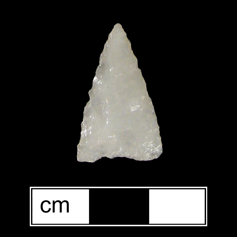 Image of stone projectile point made of Quartz, Triangular shape, with a N/A stem, Straight blade, and Concave base shape. Madison type.