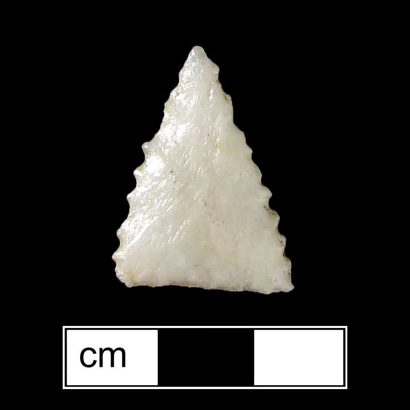 Image of stone projectile point made of Quartz, Triangular shape, with a N/A stem, Serrated-Straight blade, and Straight base shape. Madison type.