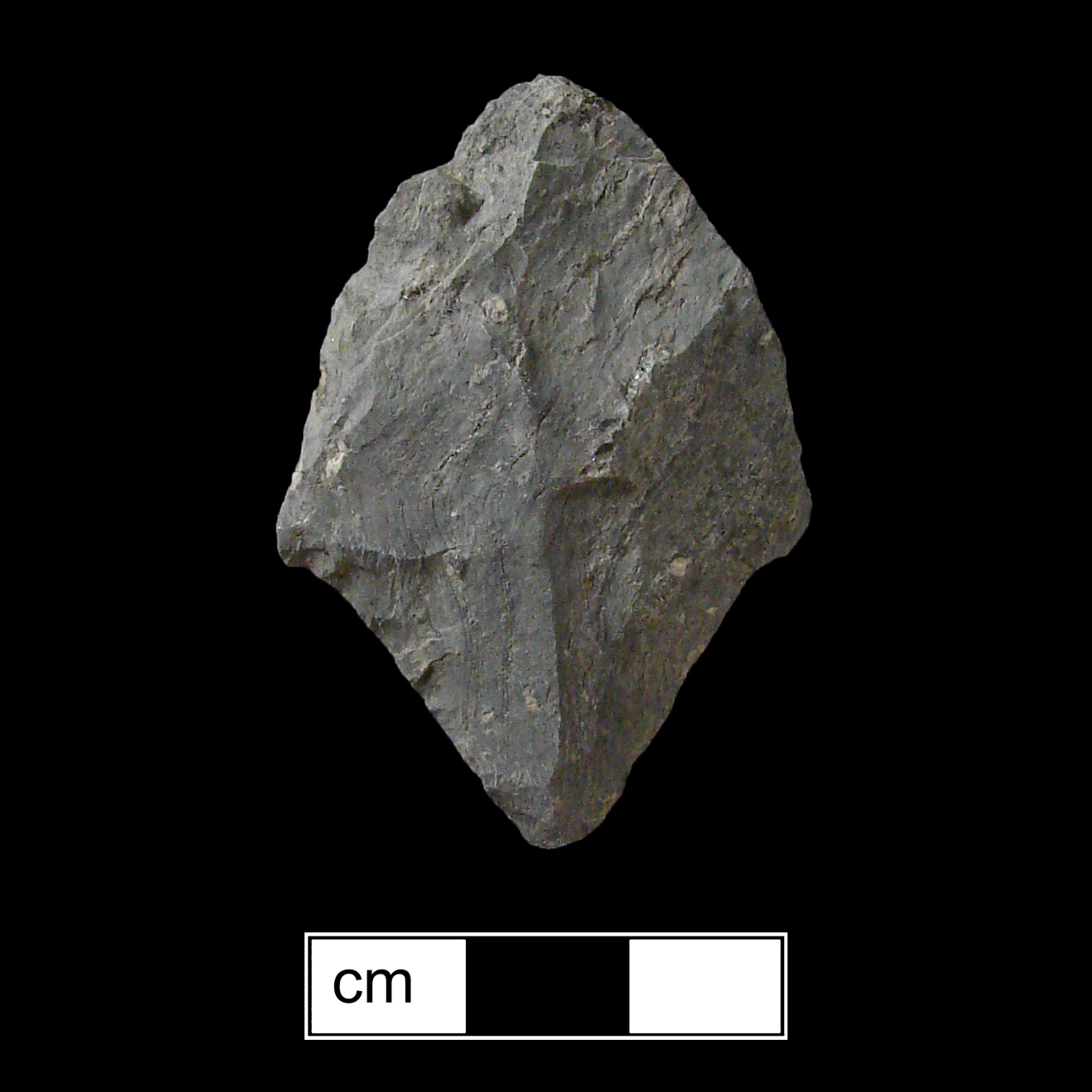 Image of stone projectile point made of Rhyolite, Contracting Stem shape, with a contracting stem, Excurvate blade, and Convex base shape. Morrow Mountain type.