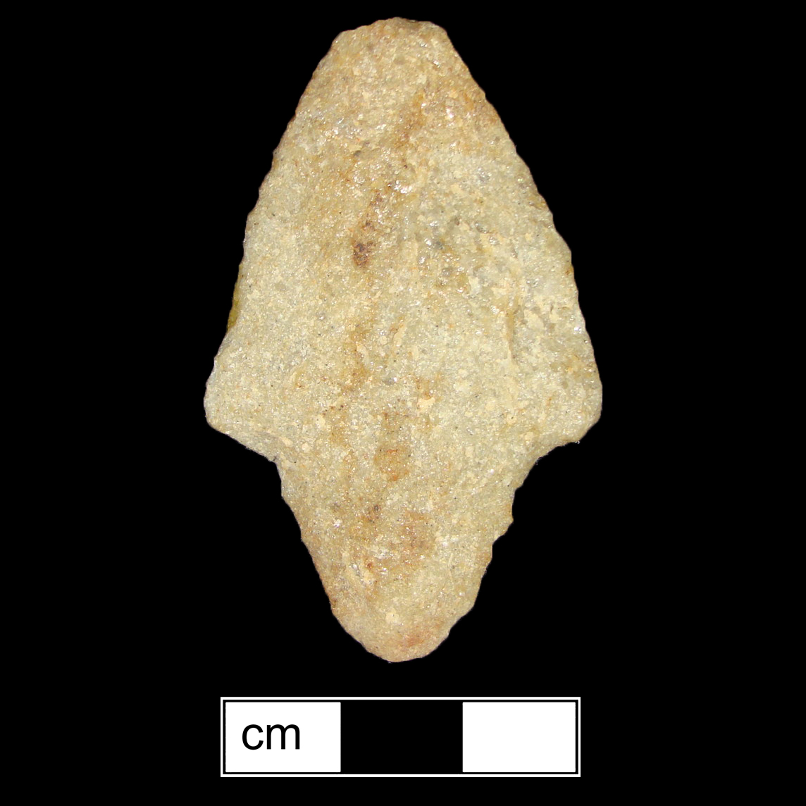 Image of stone projectile point made of Quartzite, Contracting Stem shape, with a contracting stem, Excurvate blade, and Convex base shape. Morrow Mountain type.