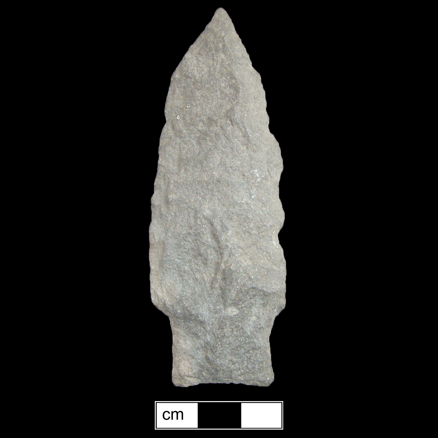 Image of stone projectile point made of Argillite, Stemmed shape, with a Straight stem, Excurvate blade, and Concave base shape. Selby Bay/Fox Creek type.