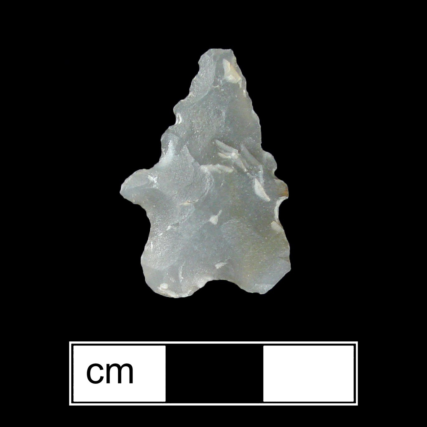 Image of stone projectile point made of Quartz, Bifurcate shape, with a Expanding stem, Serrated-Straight blade, and Bifurcate base shape. St. Albans type.