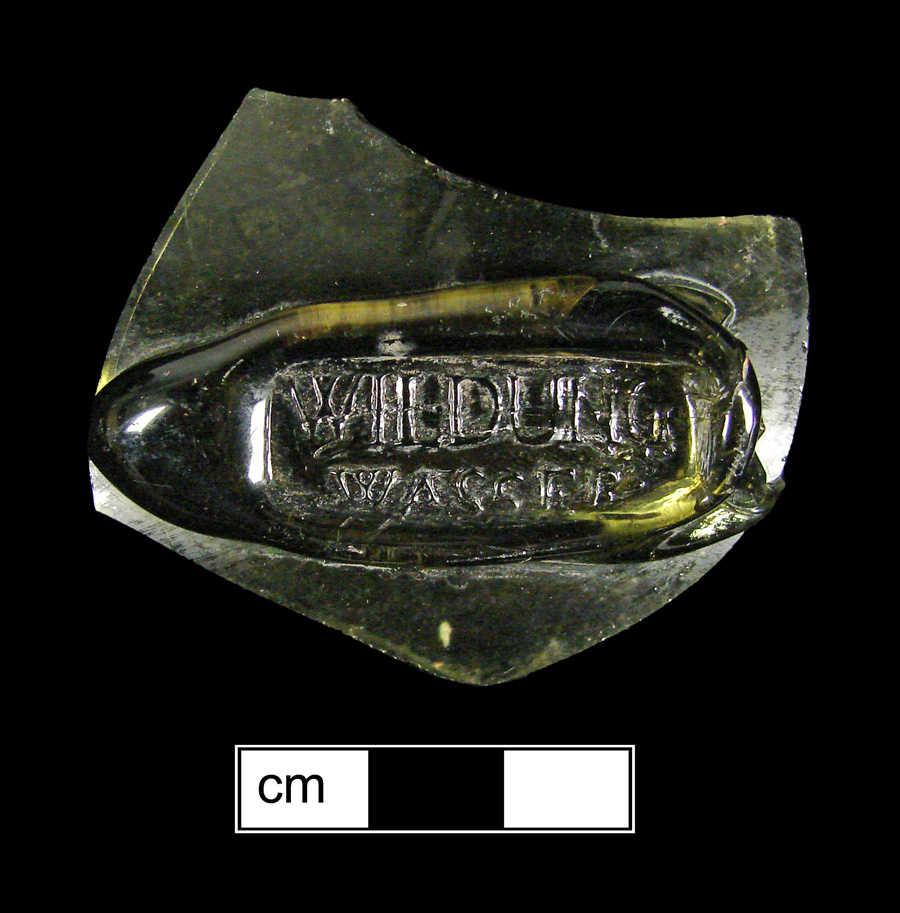 Image of colored glass bottle seal, Commercial Mark.
