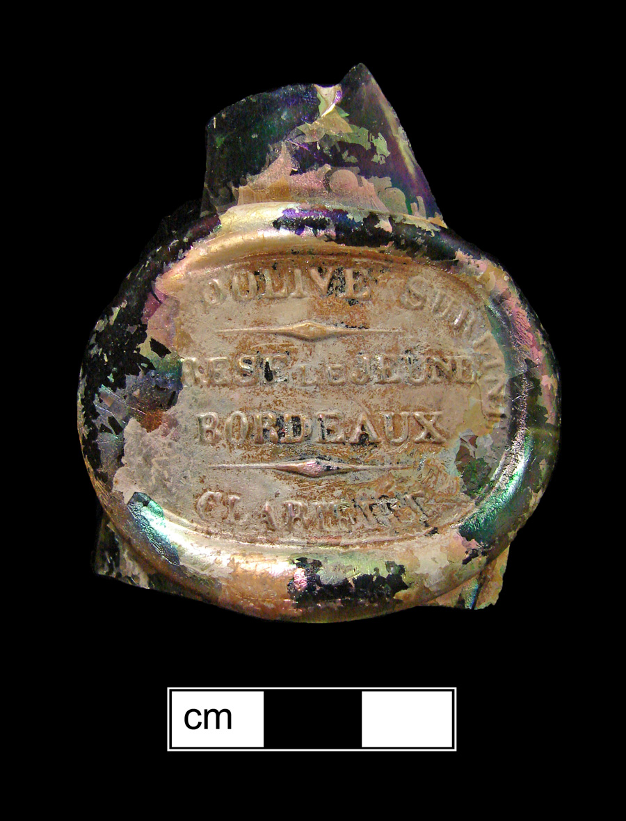 Image of colored glass bottle seal, Commercial Mark.
