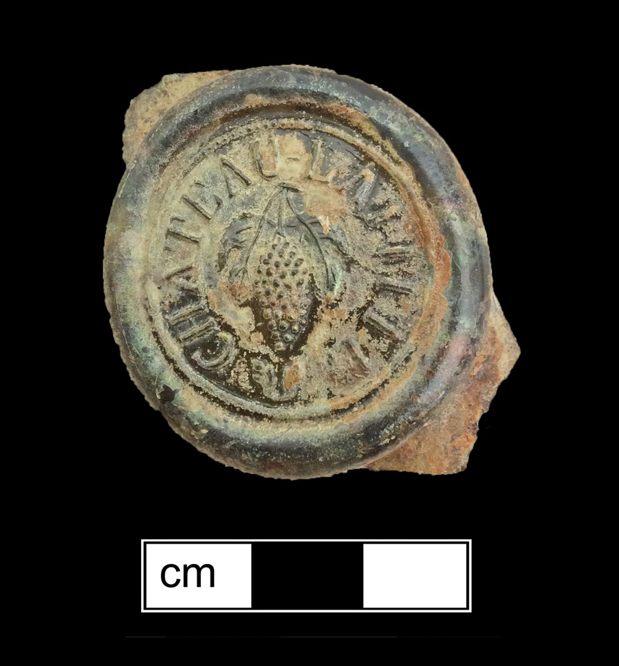 Image of colored glass bottle seal, Commercial Mark.