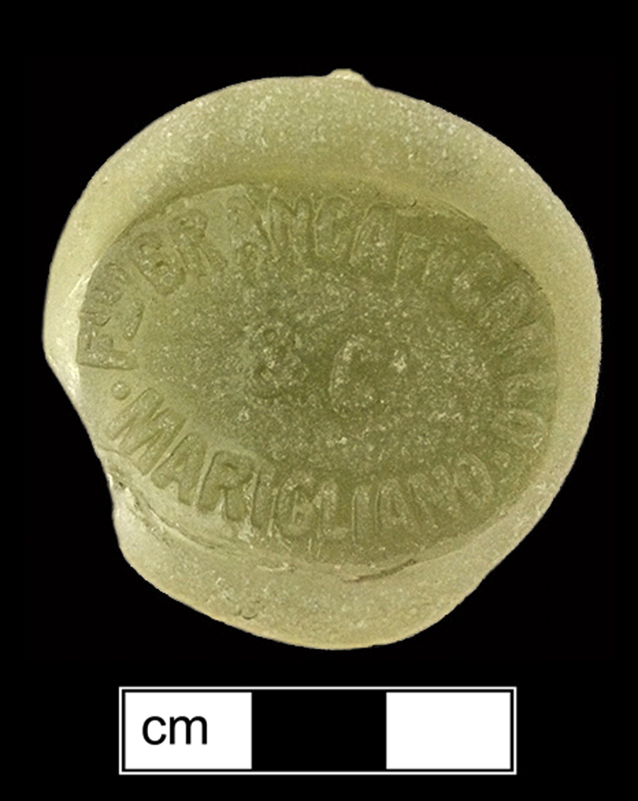 Image of colored glass bottle seal, Commercial Mark.