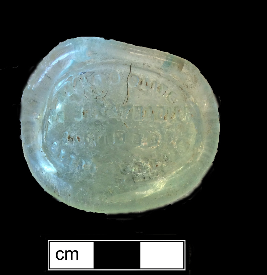 Image of colored glass bottle seal, Commercial Mark.